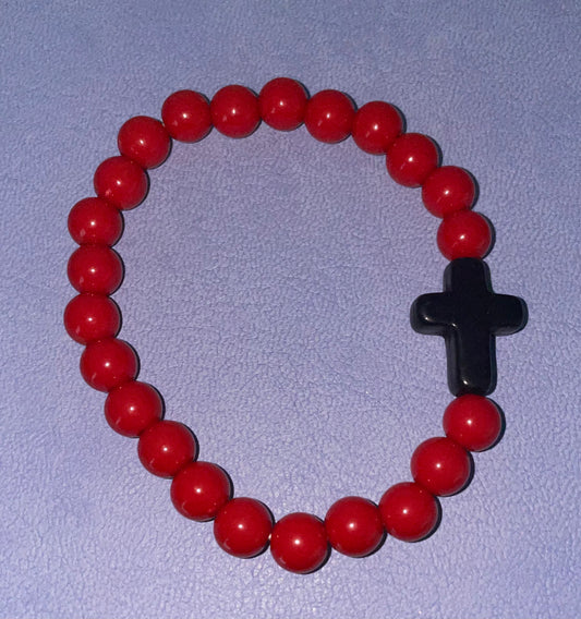 Single beaded red bracelet with black cross