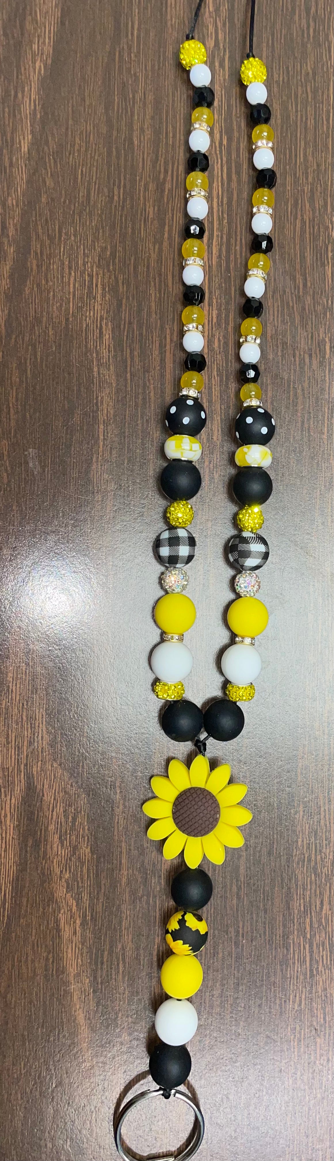 Yellow, black and white lanyard